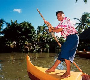 Hawaiian Man in a Canoe