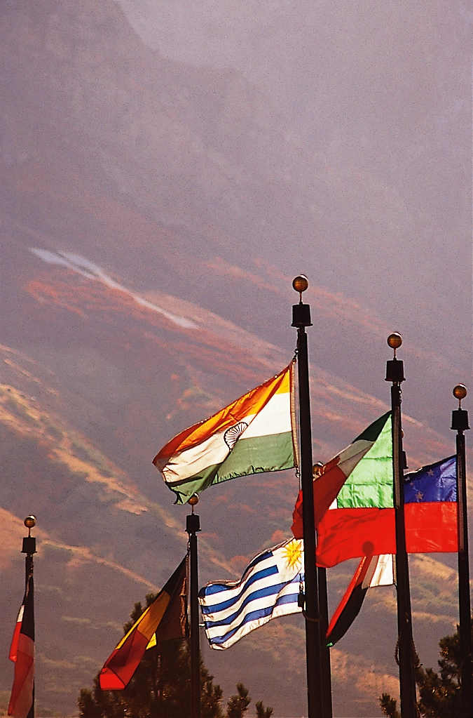 Flags from different nations blowing in the breeze.