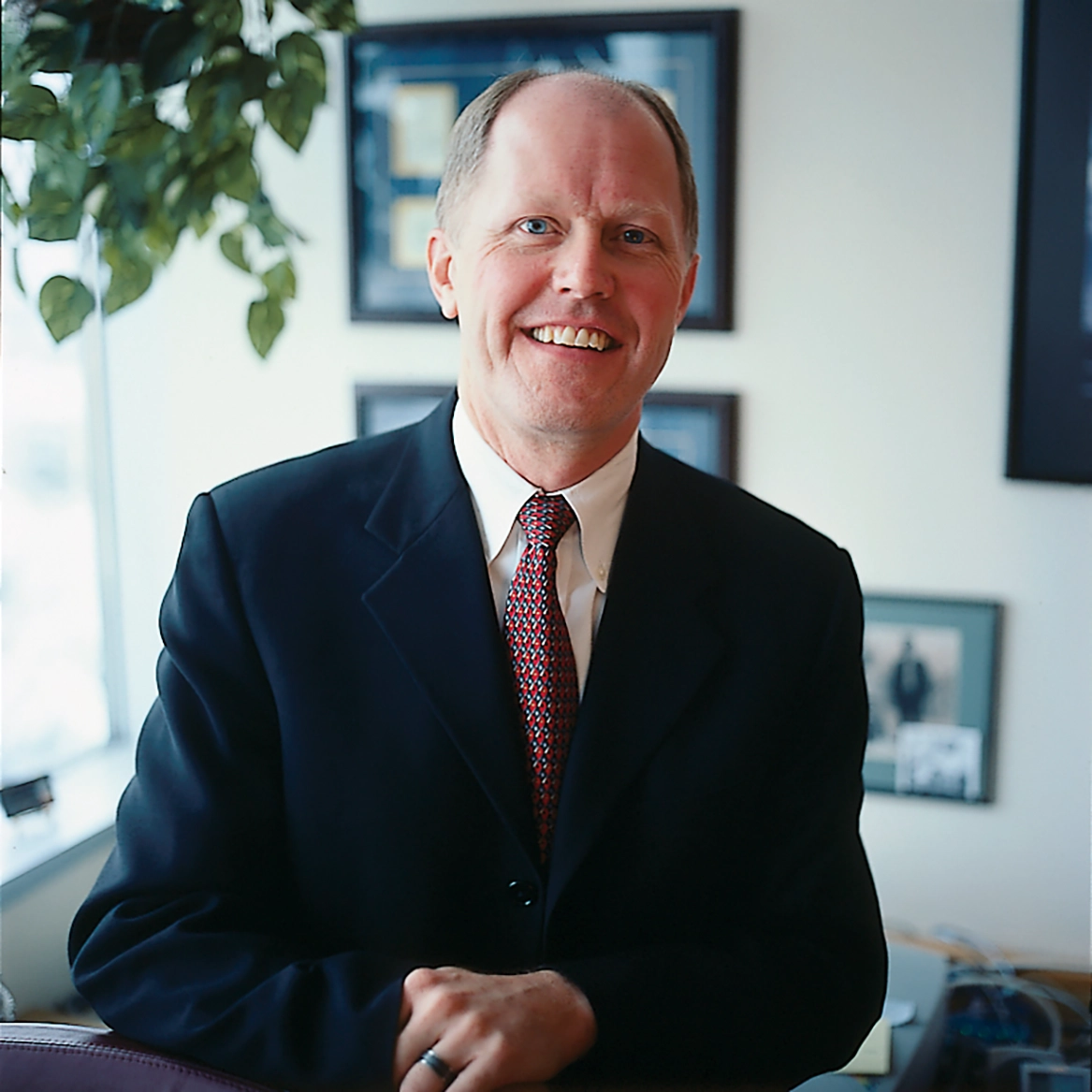 James Stice poses in an office.