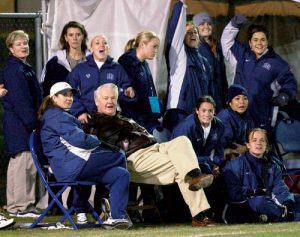 President Bateman with the BYU women's soccer team at a BYU soccer game