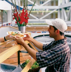 A man being served quesadillas at the Marketplace Cafe.