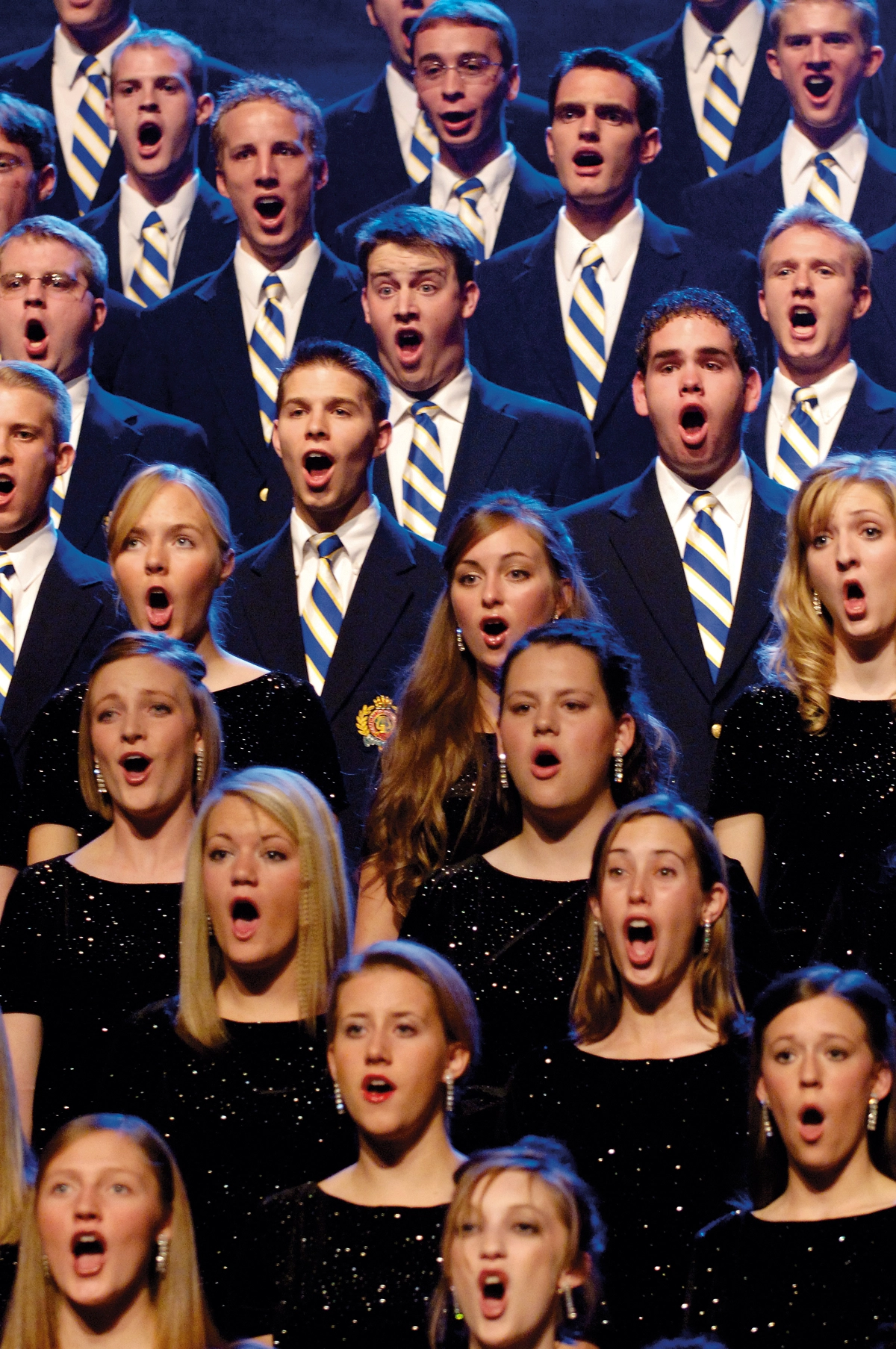 Men and women singing in a choir.