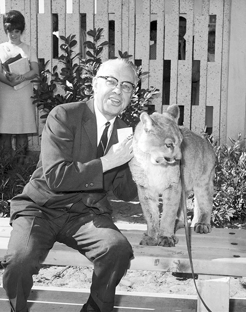 President Ernest Wilkinson poses with Sparrow, a living cougar.