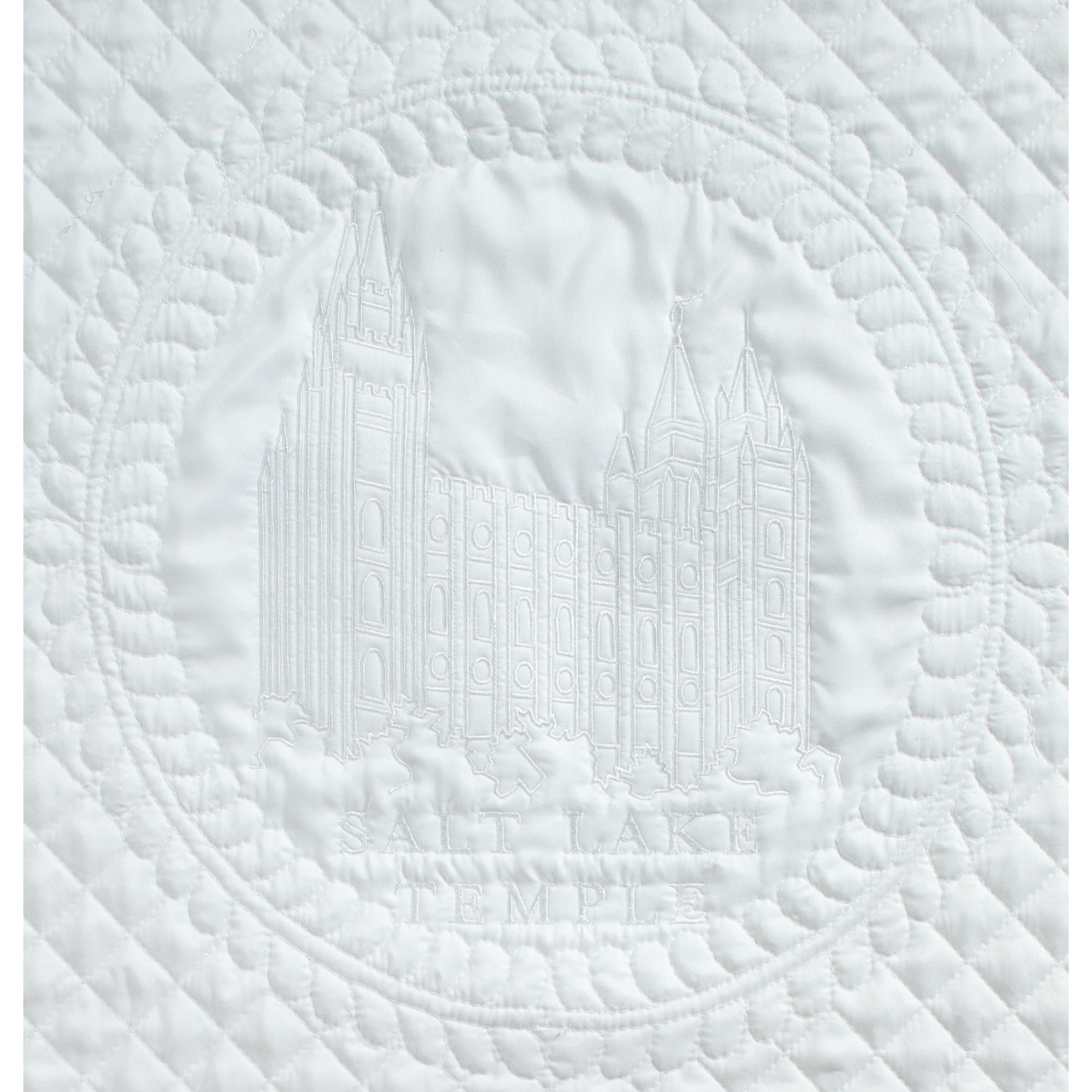The Salt Lake Temple embroidered on fabric.