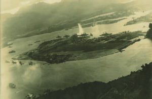 An archival aerial photo of Pearl Harbor being bombed on December 7, 1941