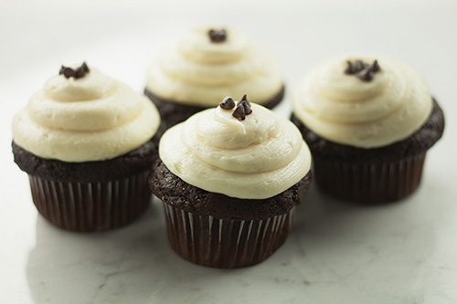 A photo of The Sweet Tooth Fairy's Black and White cupcakes