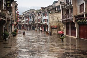 After Lucy Call took this photo of a lady carrying vegetables and an umbrella in the ancient city of Zhenyuan, Guizhou Province, she didn't think much of it. "It was a friend who saw it and loved it and convinced me to use it in the show," she says. Photo by Lucy Call.