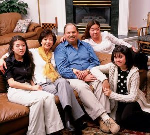 For several years Roby's husband, C.Y. (center), would joke that adoption was hereditary in their family. Both Jini and C.Y. were adopted as children, and they adopted Micia (left) and Mikkel (second from right) before Jini gave birth to Marika (right). Adoption has been a focus of Roby's volunteer and professional activities; she has also worked with and studied child abuse, elder abuse, and domestic violence. 
