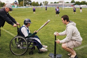 At the Special Olympics 2010 Summer Games, Daniel J. Falk ('10), an exercise science major from Wilsonville, Ore., sets up a T-ball for Special Olympian Mike Carter of the Work Activity Center Team. Every year the BYU Center for Service and Learning collaborates with Utah's Special Olympics office to host the event. BYU students--liek Sarah A. Ingalls (BS '10), bottom left, an exercise science major from Claremont, calif.--plan the opening and closing ceremonies, provide health and safety services, support events with score keeping and timing, and cheer for athletes. And at the May 2010 games, a new team of Special Olympians took the field, coordinated and coached by BYU students. 