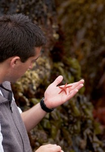 A student holds a star fish