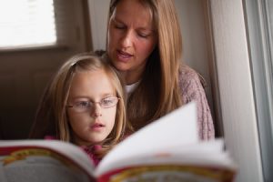 Drawing on what she learned at BYU, Katie Van Dyke uses various activities to help her daughter learn each day while waiting for the bus. 