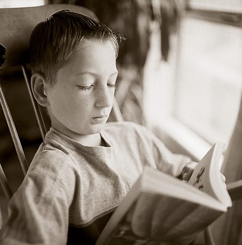 A young boy reading