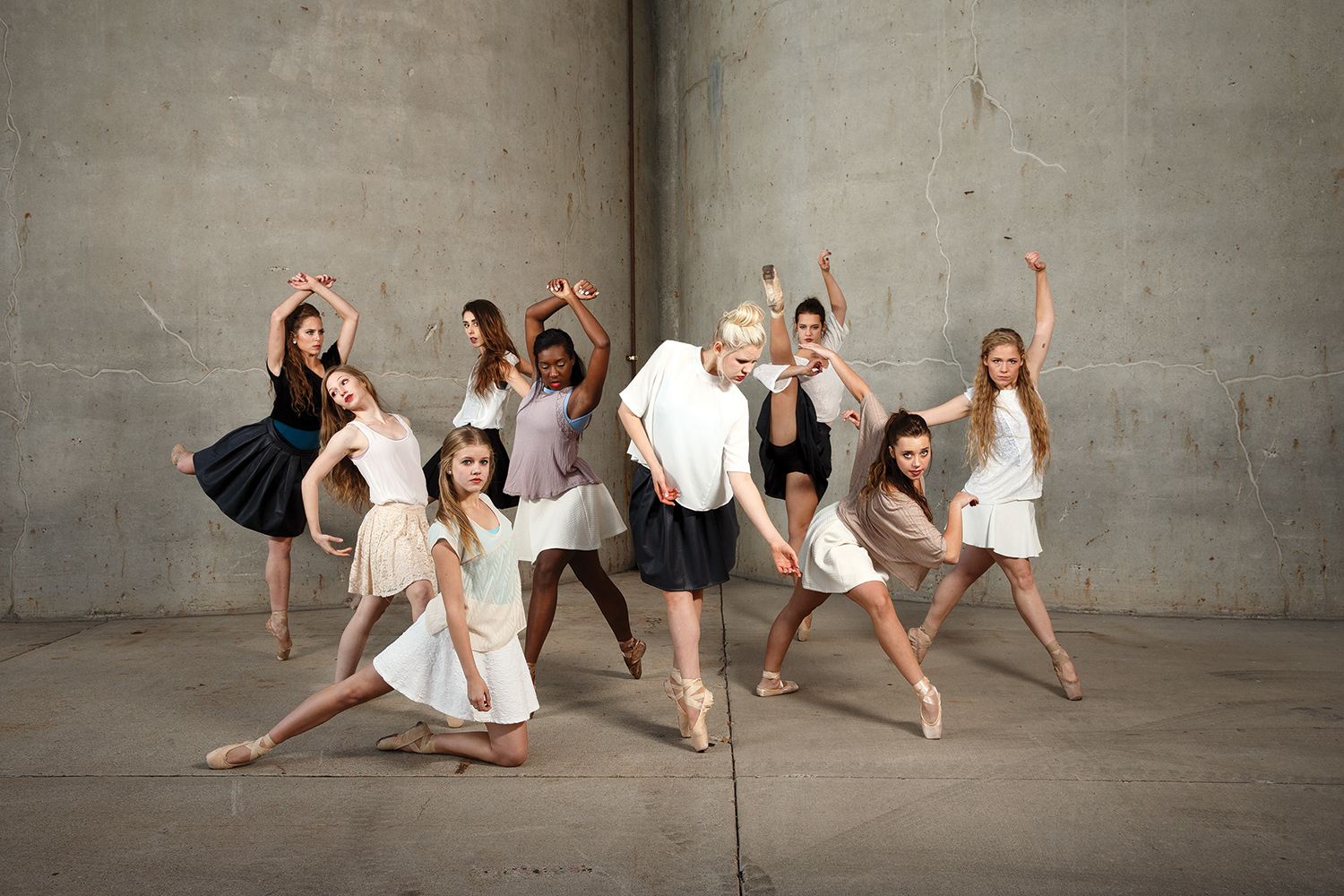 BYU Theatre Ballet dancers posing in dance moves for a photoshoot.