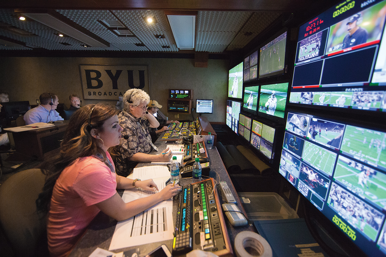 The BYUtv production crew puts together a game broadcast from a truck in the parking lot.