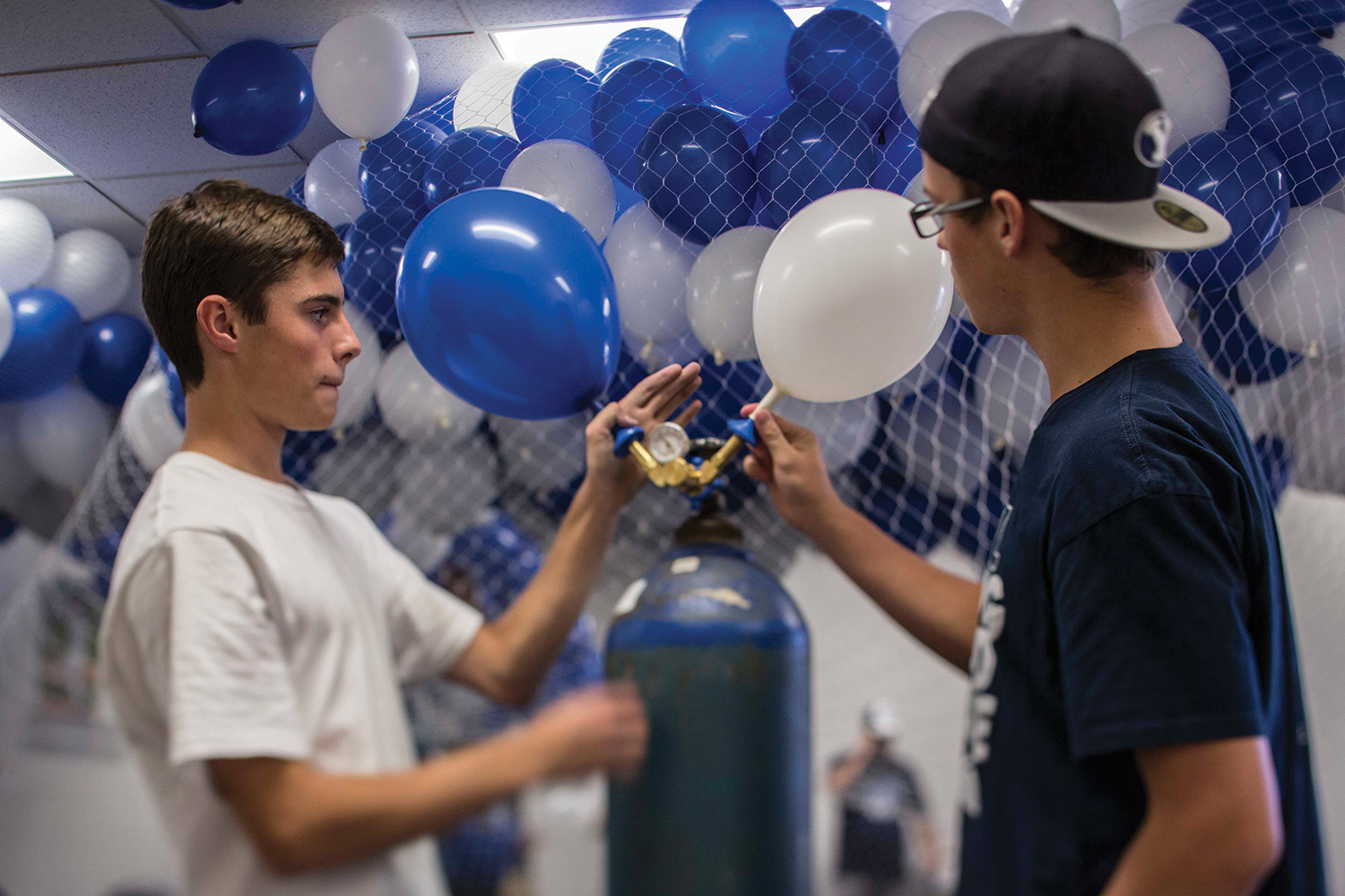 Students inflate 5,000 balloons in preparation for the upcoming football game.