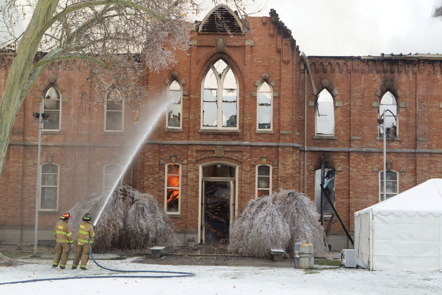 The remains of the Provo Tabernacle after the fire was put out. The structure was reduced to a roofless, charred shell.