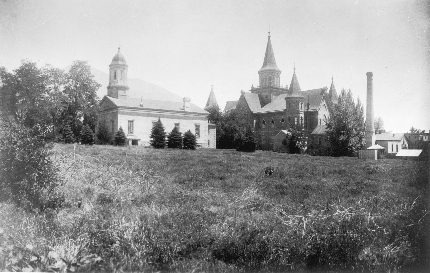 Black and white photos of the Provo Tabernacle and the Academy Building.