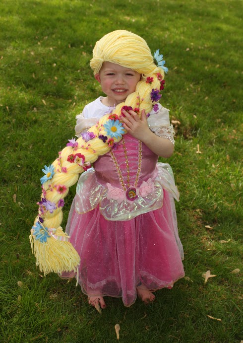 Young cancer patient wearing a princess wig.
