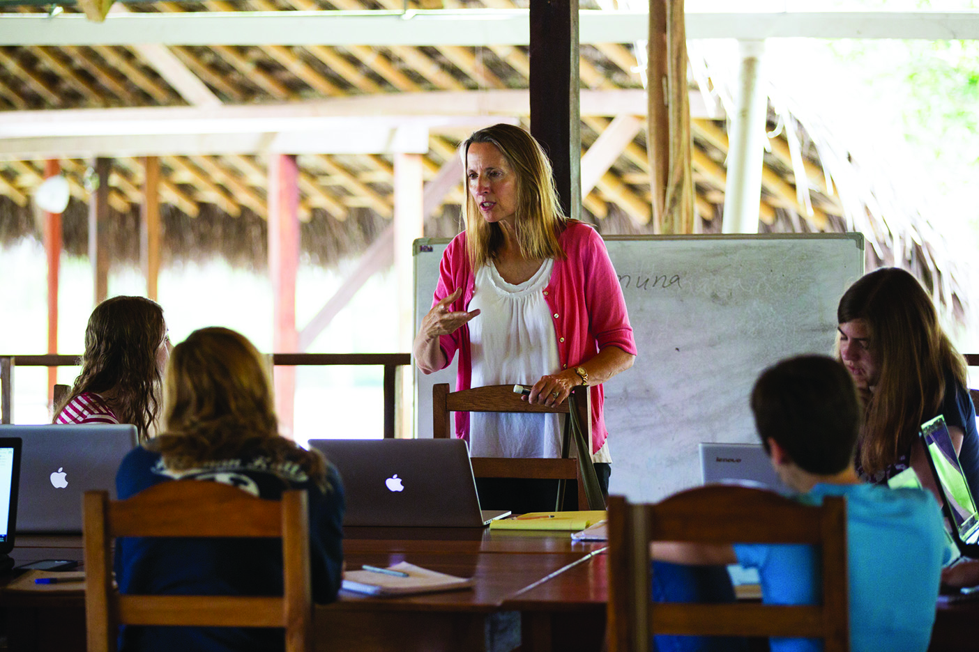 Nuckolls presents at the front of the class in the open-air field school