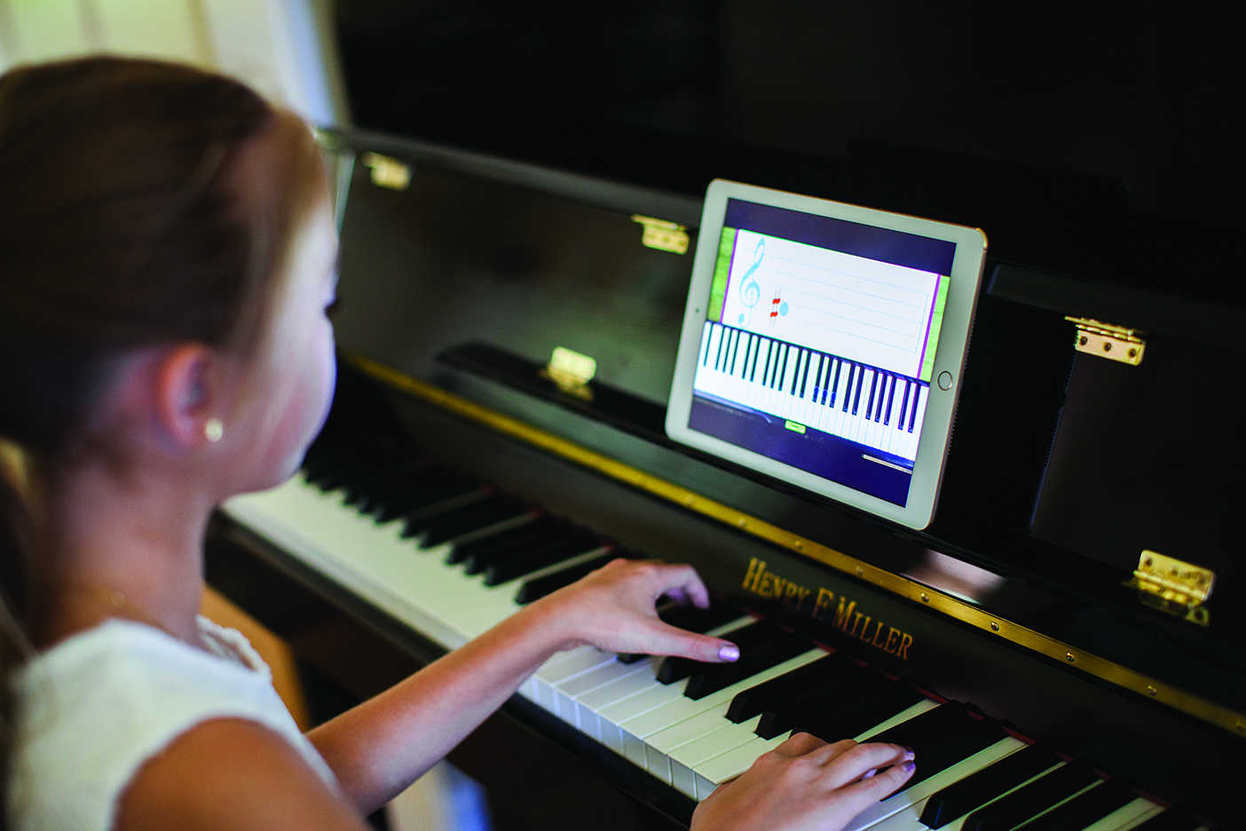 A girl practices the piano.