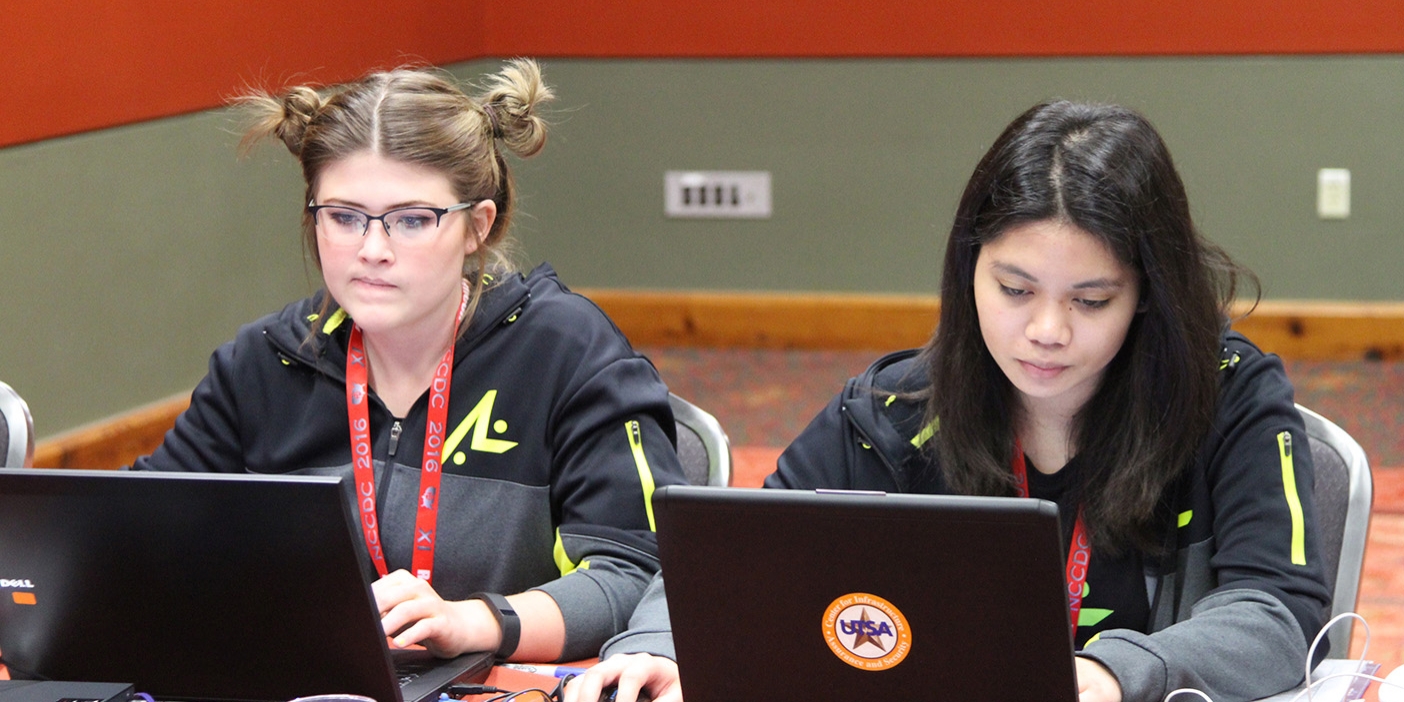 Two girls at their computers