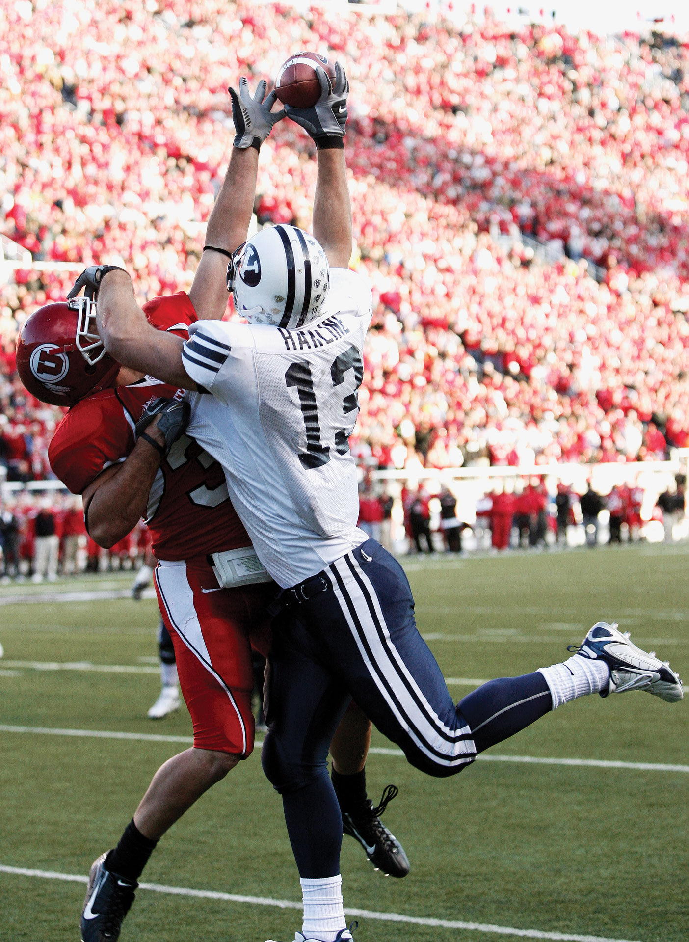 In the 2006 game against Utah, Jonny Harline battles with a defender for one of his three touchdown receptions.