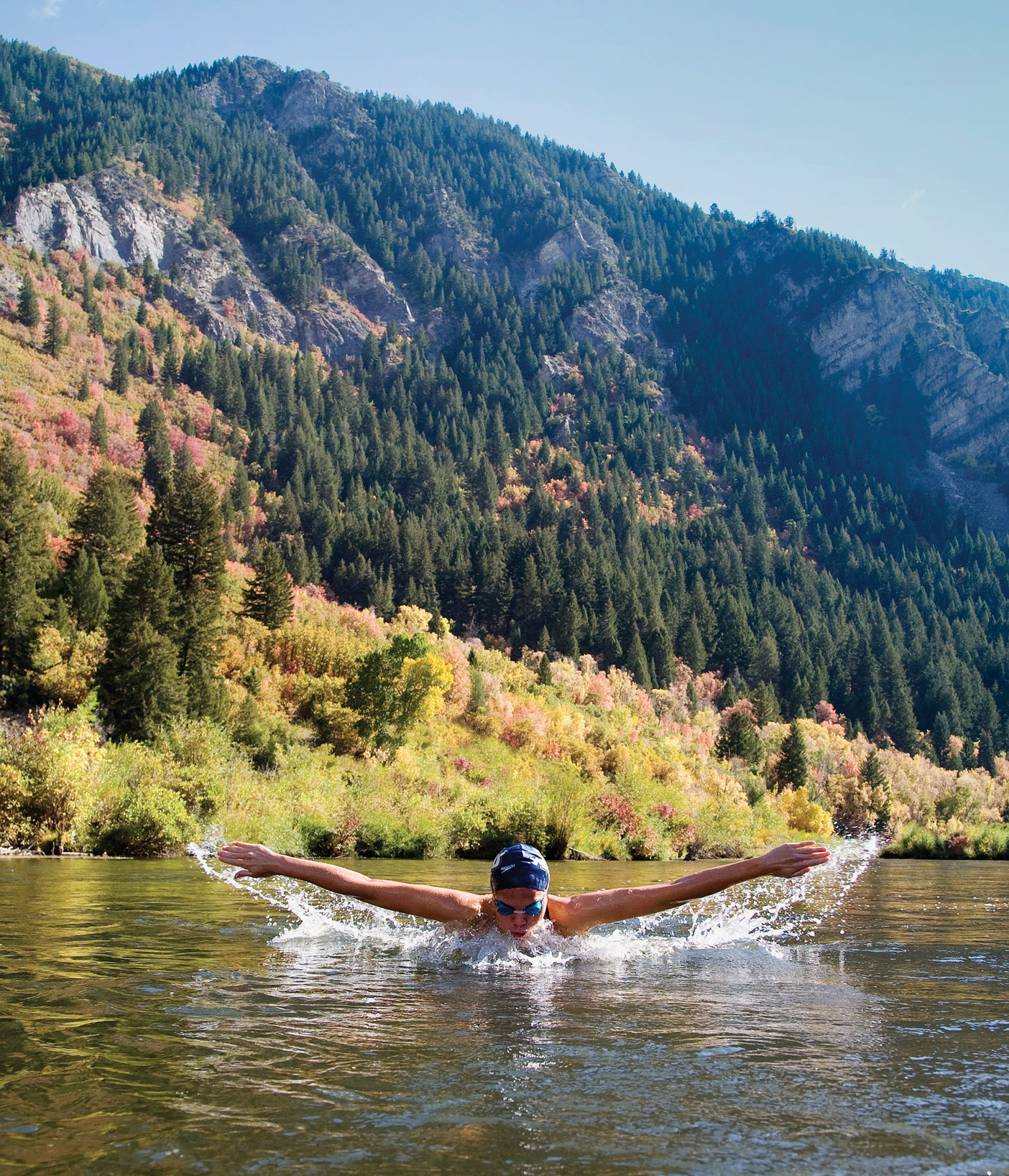 Mark Philbrick waded into the icy Provo River to photograph BYU swimmer Rachel Grant.