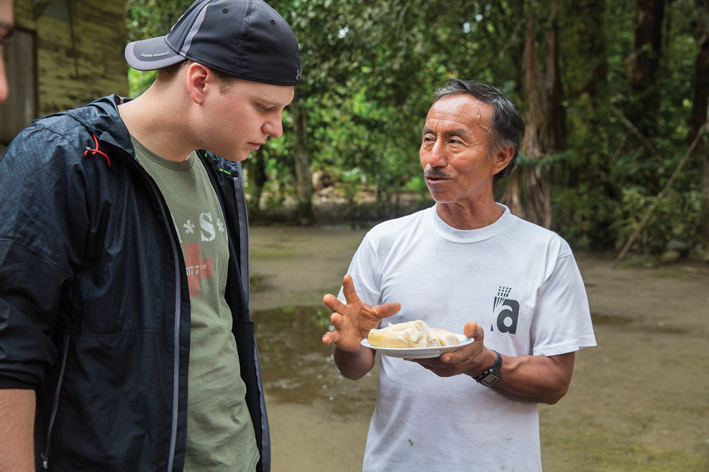 Cezar, owner of a cooperative farm, answers questions from grad student Alexander H. Rice