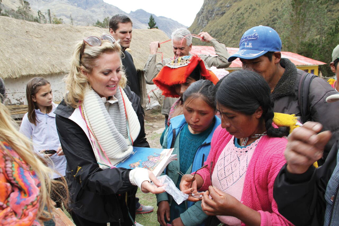 Ann Romney in Peru doing relief work and talking to locals.