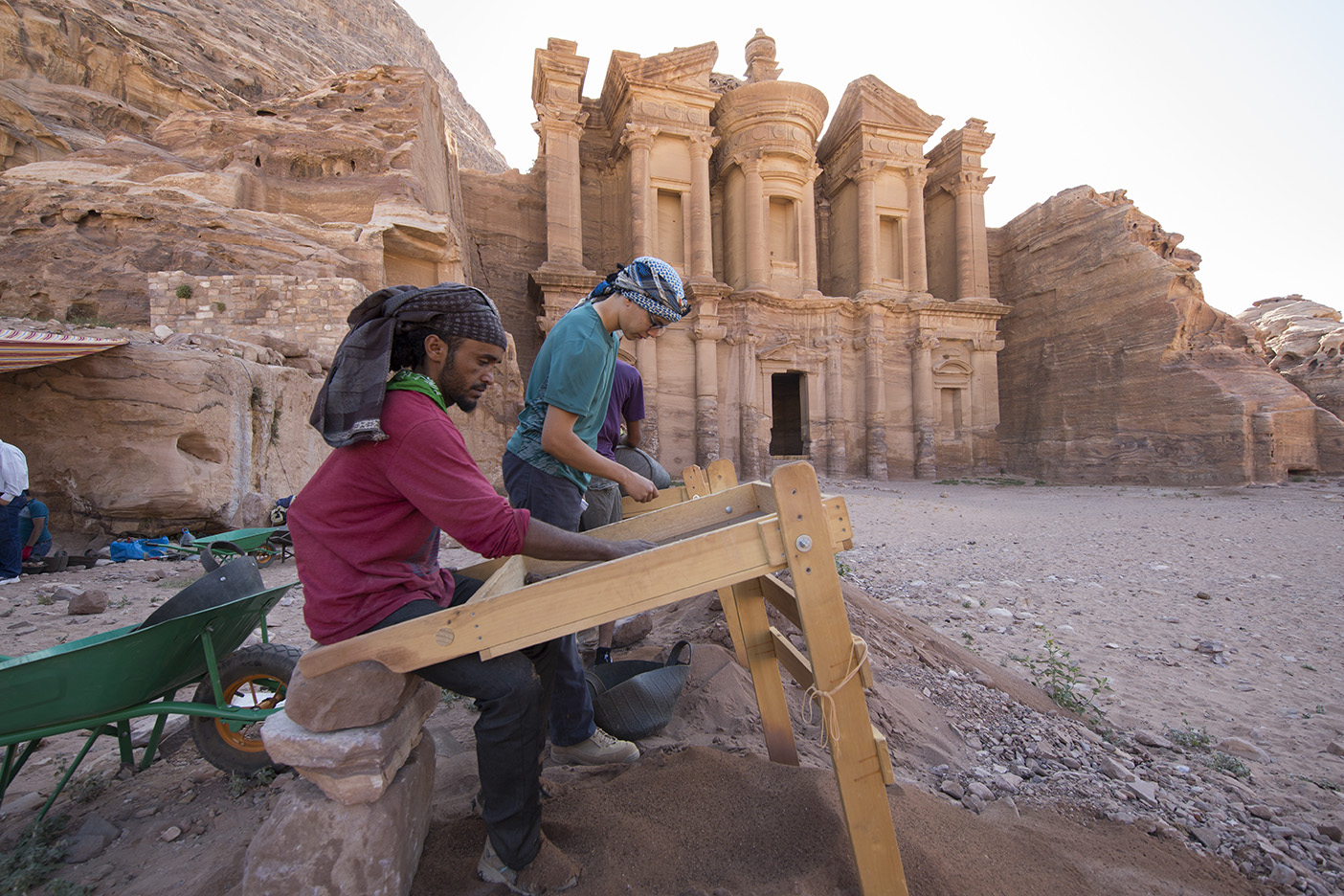 A BYU student working alongside a Bedouin colleague on the Ad-Deir Monument project.