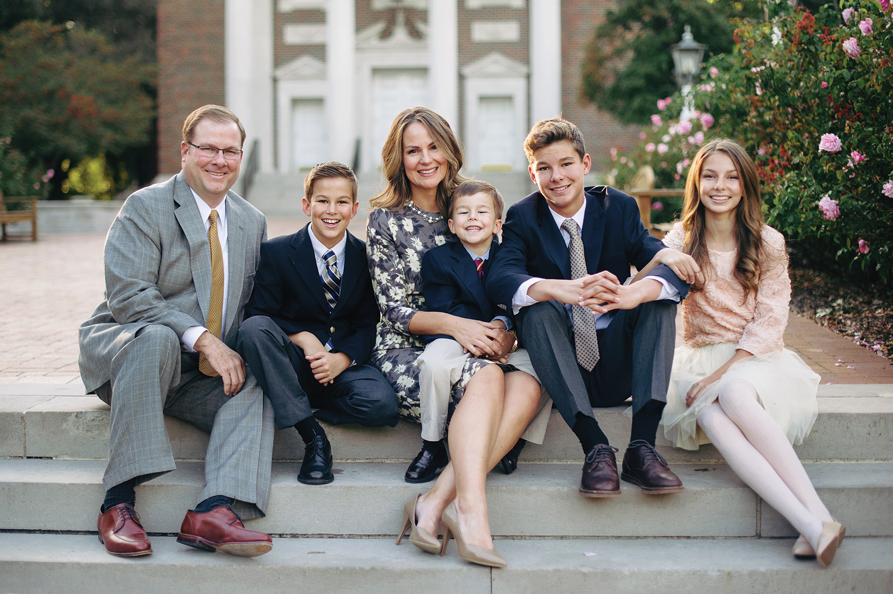 Alumni president Amy Fennegan and her husband, Garth, sit with their children Sam, Boone, Cade, and Reaves.