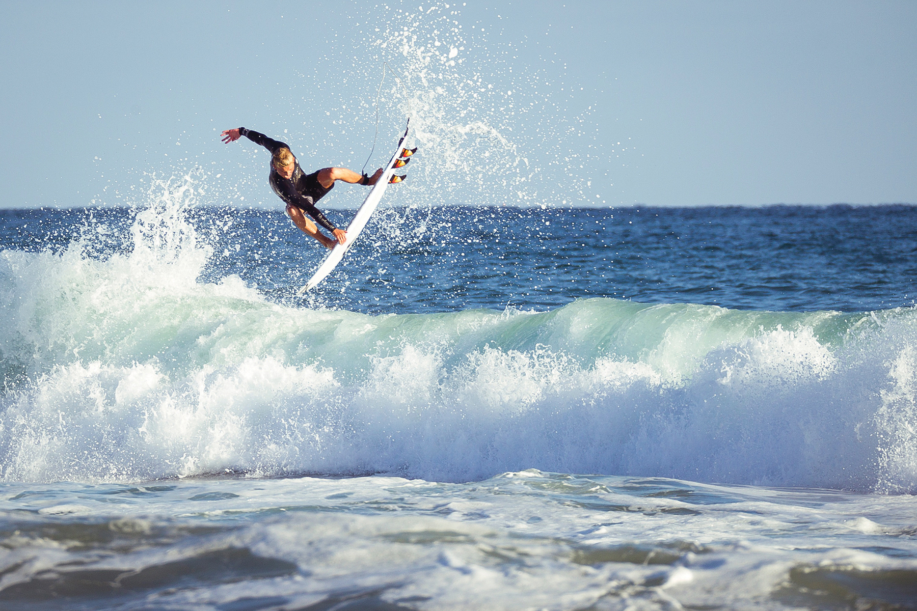 Jordy Collins, an up-and-coming surfer, riding the waves.