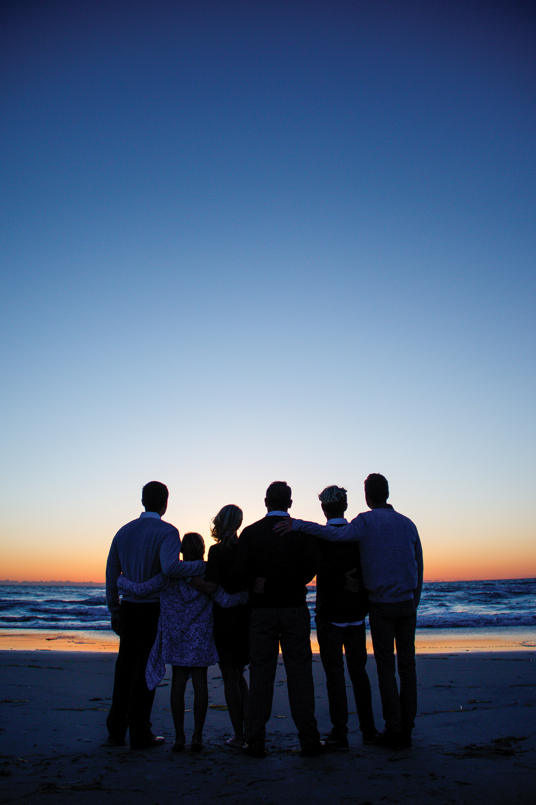 The Collins family by the beach.