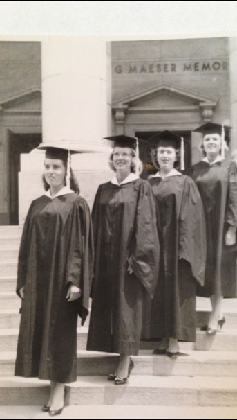 JJoan Davenport, Betty Moody, Sharon Senecal, and Dorene Sheldon wear their graduation robes in front of the Maeser Building in 1958. Photo courtesy of Betty Moody.