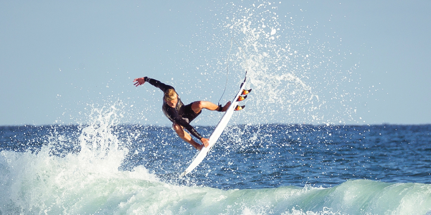 Jordy Collins surfs a wave