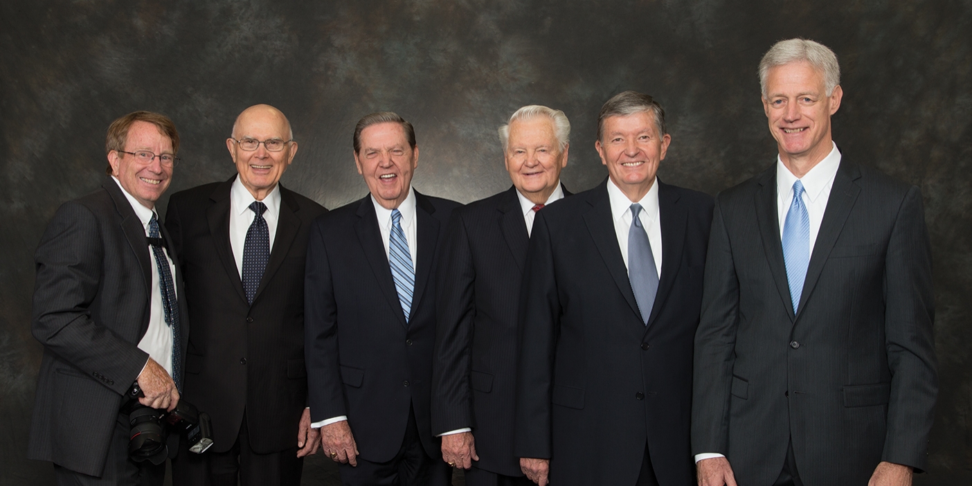 Mark Philbrick pictured with the five living BYU presidents he worked under as university photographer.