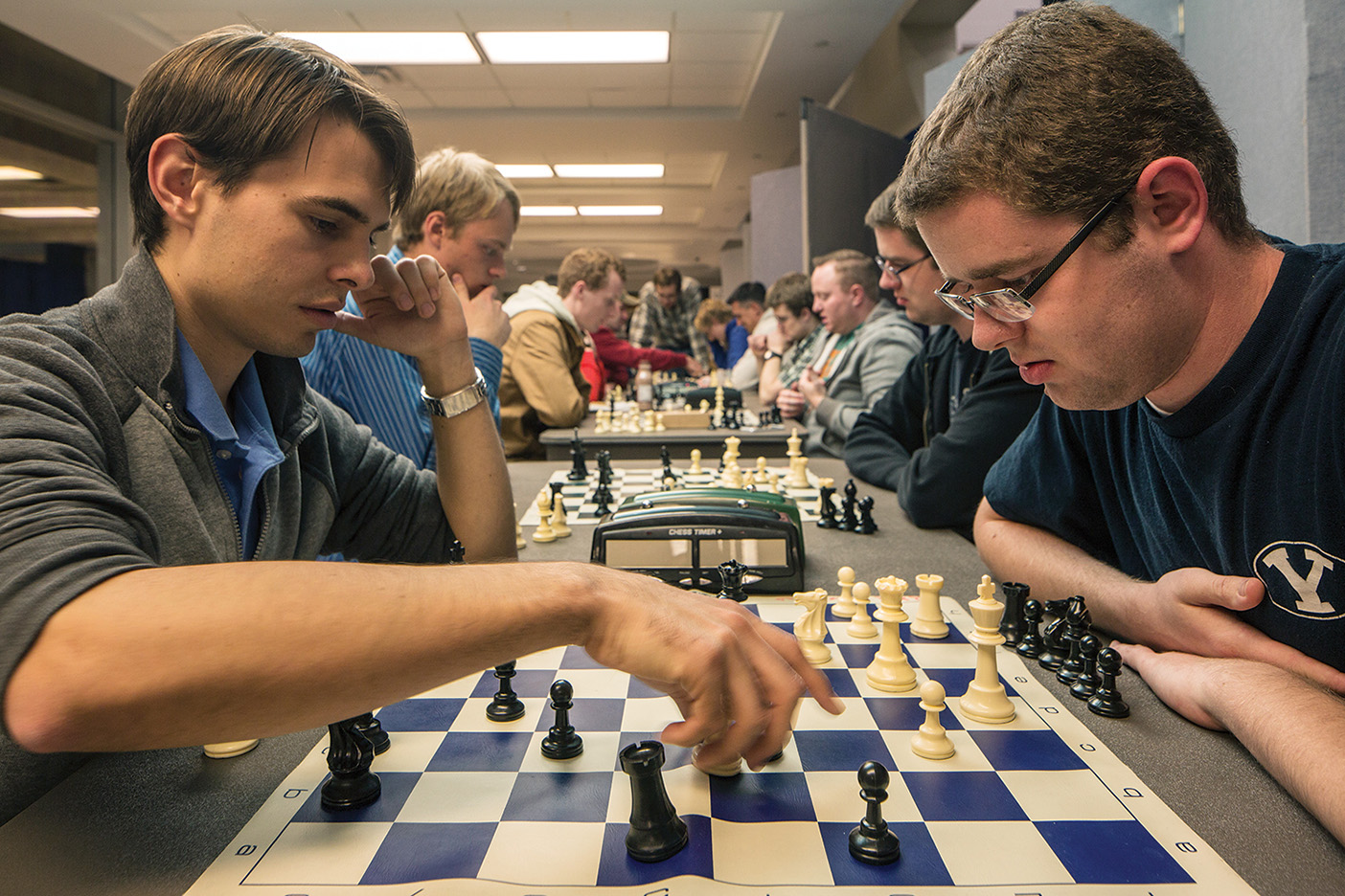 Students play chess.