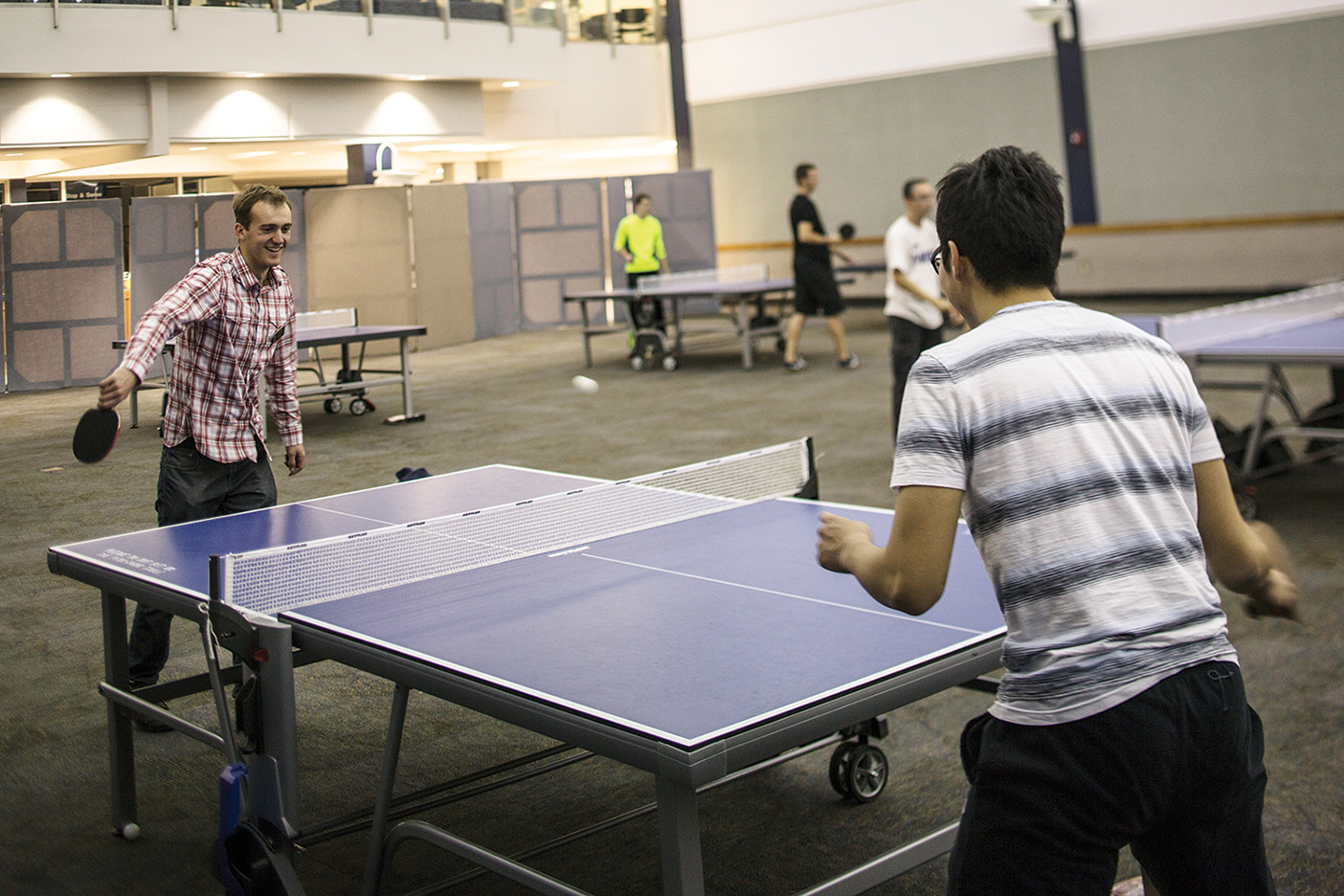 Students play ping-pong.
