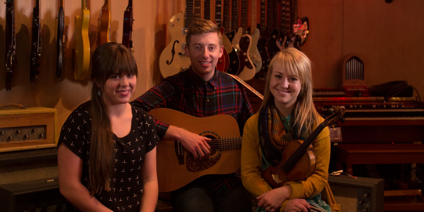 Sydney Macfarlane, Brady Parks, and Paige Wagner, the members of the National Parks band