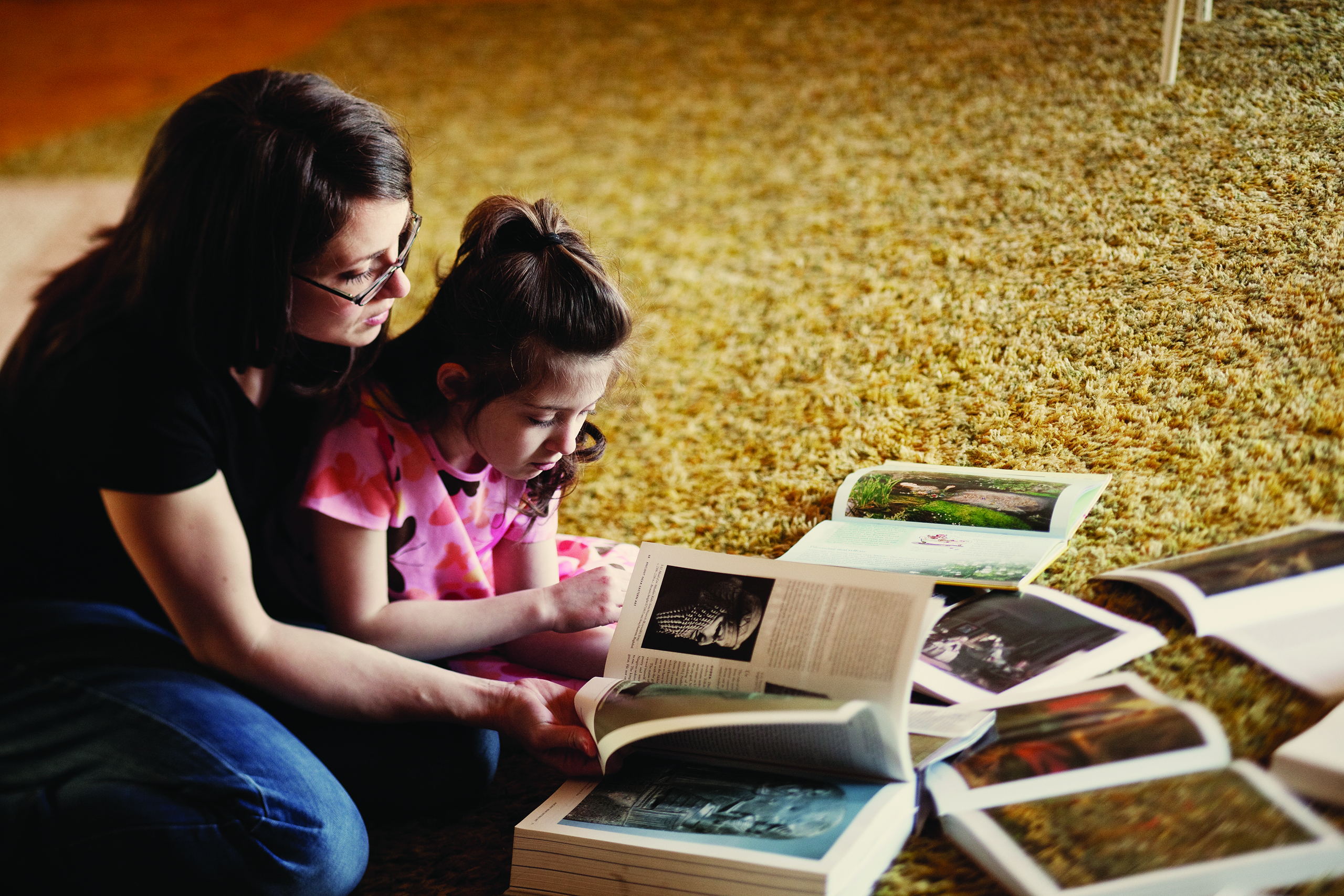 mother and daughter reading a magazine