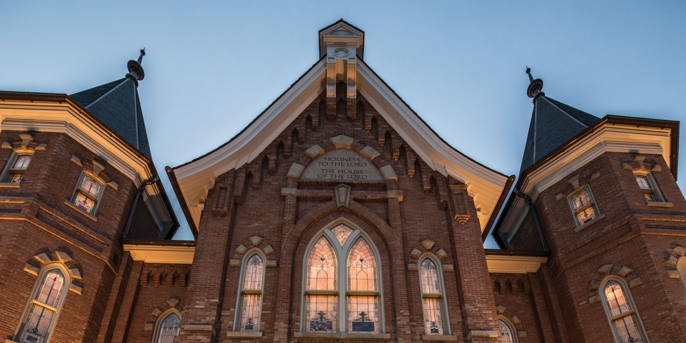 A shot of the Provo City Center Temple withe the windows lit at dusk