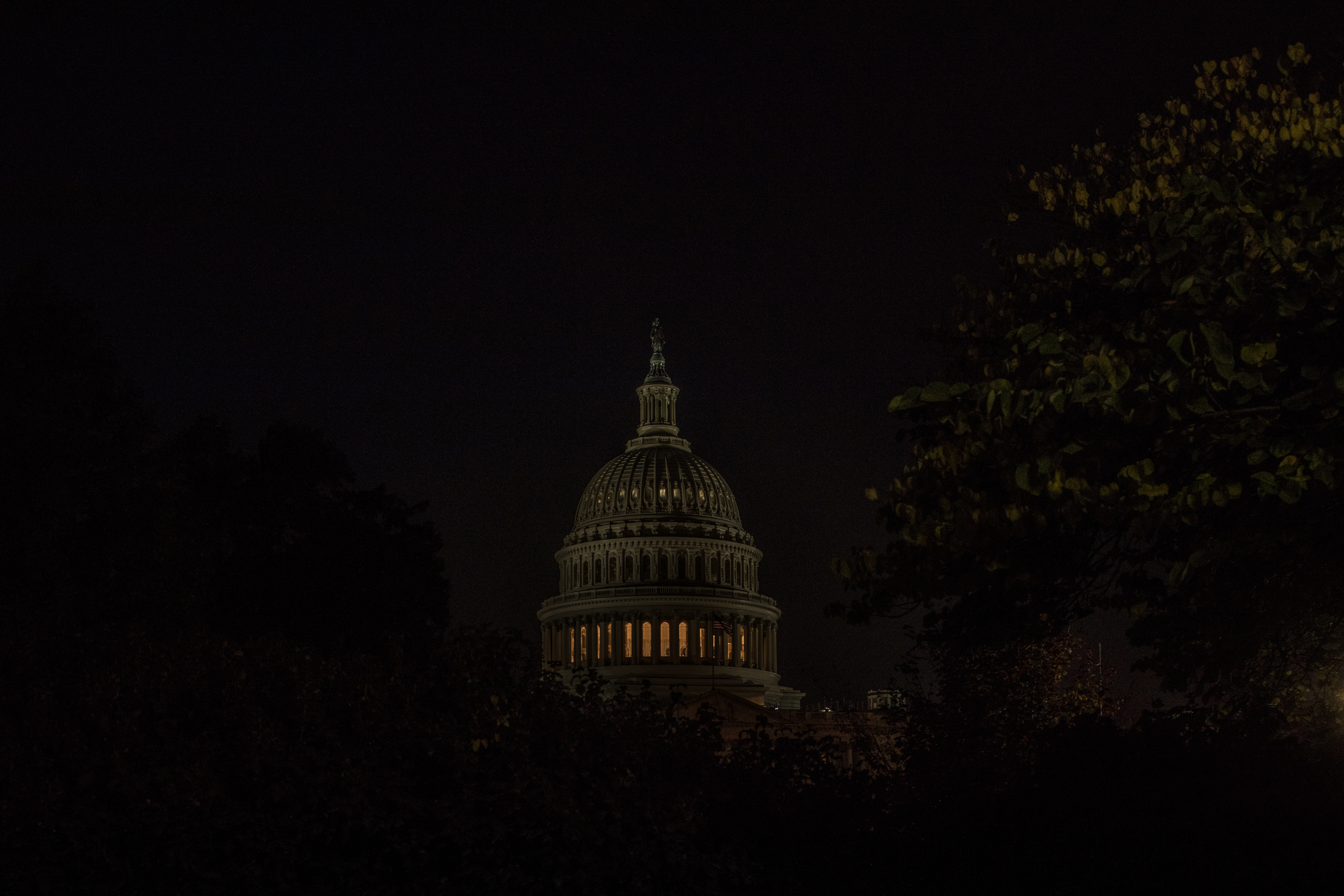 The U.S. Capitol lit up at night.