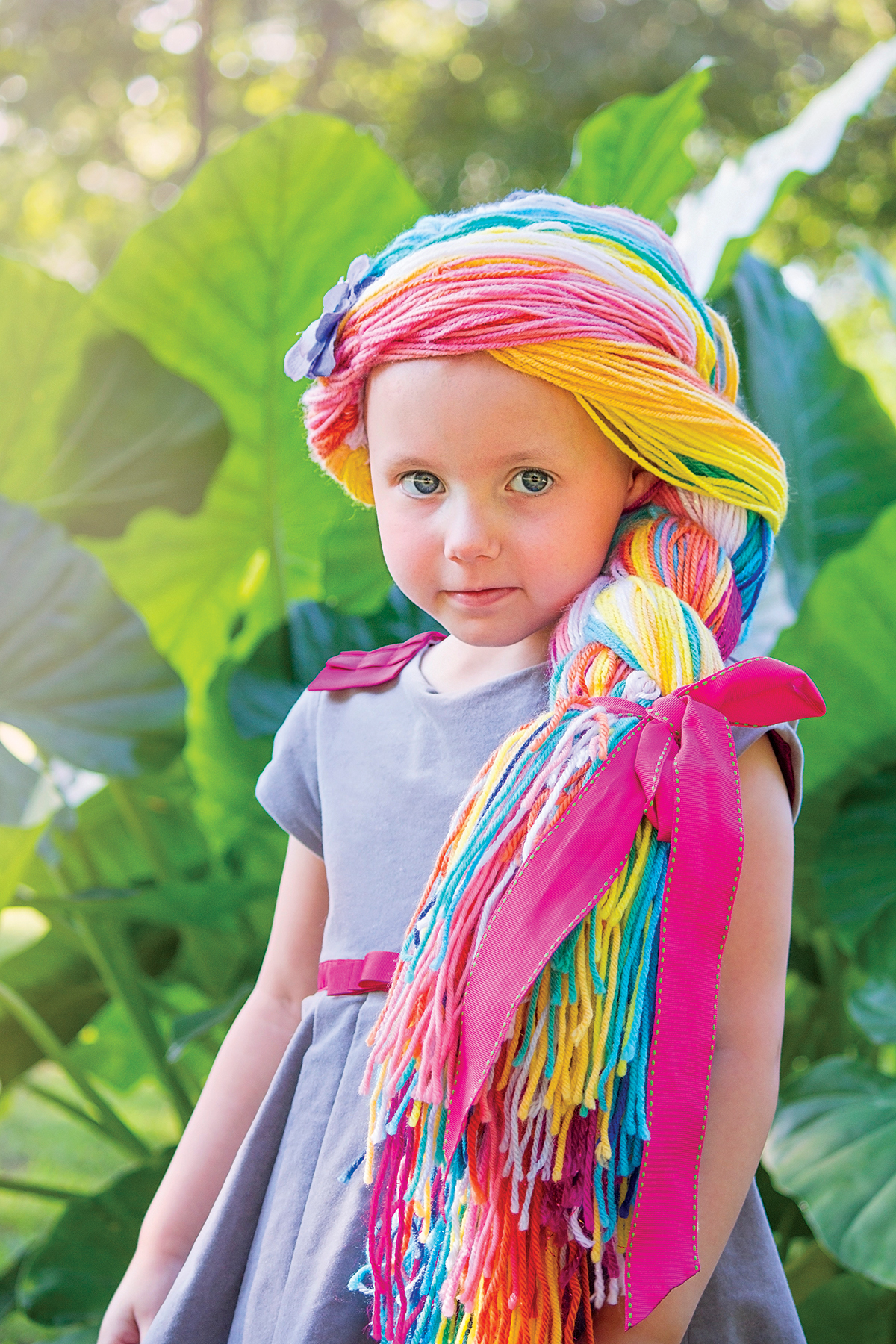 little girl with yarn wig