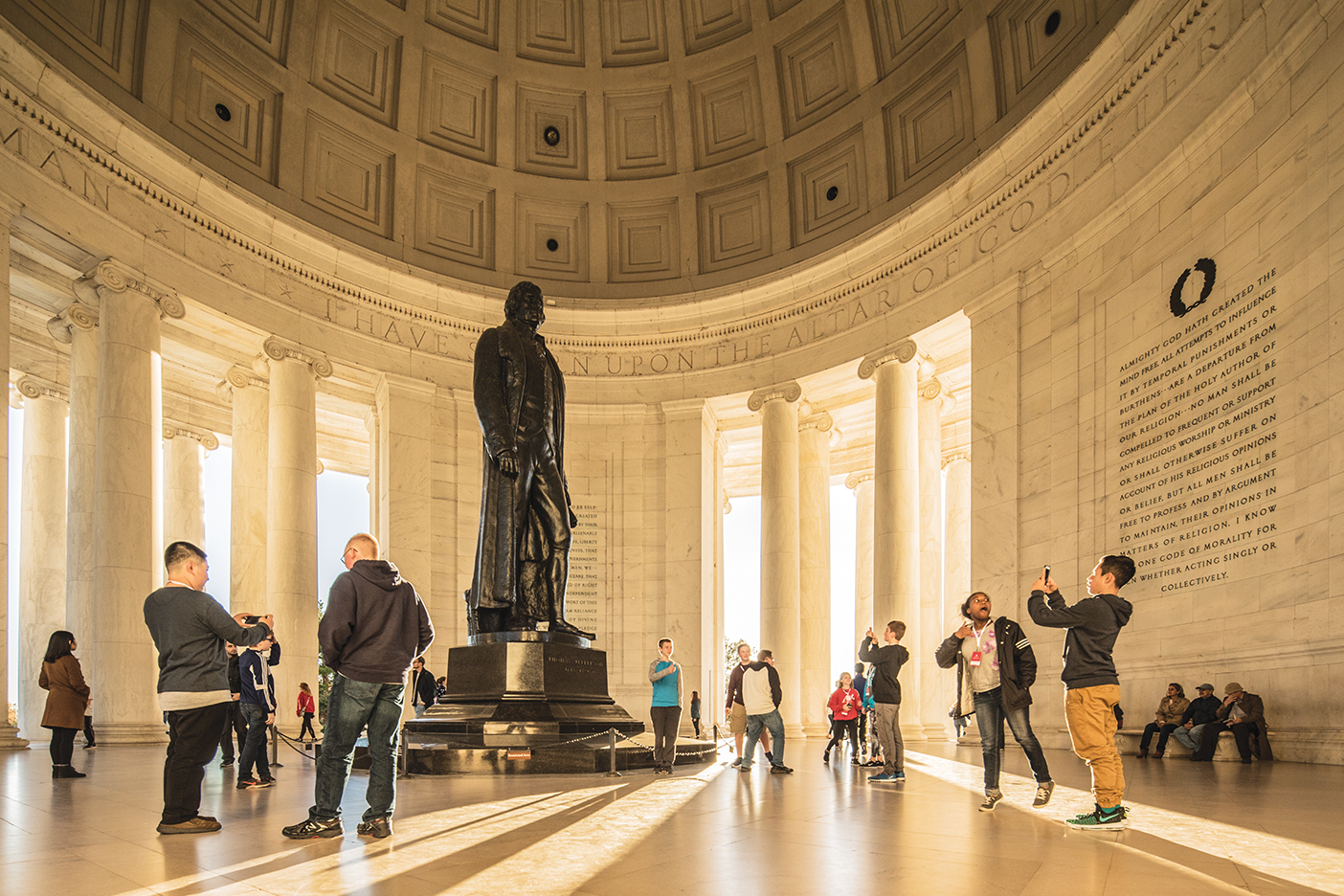 Visitors take pictures of the Jefferson Memorial.