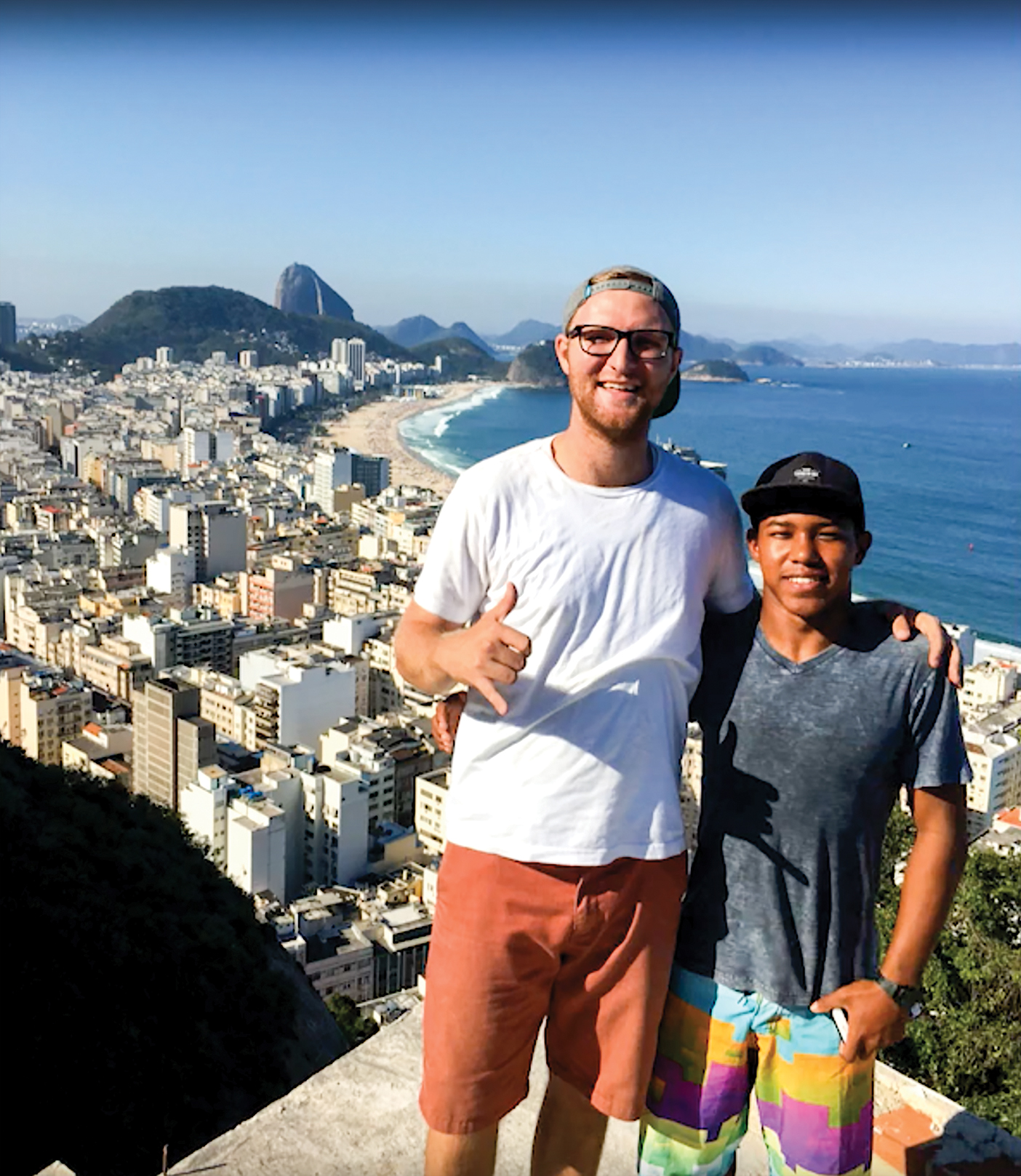 Bryce Hawkey and friend with city in the background