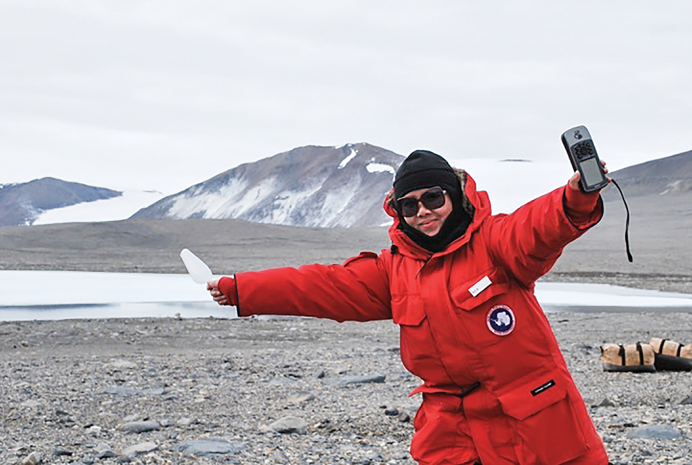 Summer Xue in a red coat in Antartica