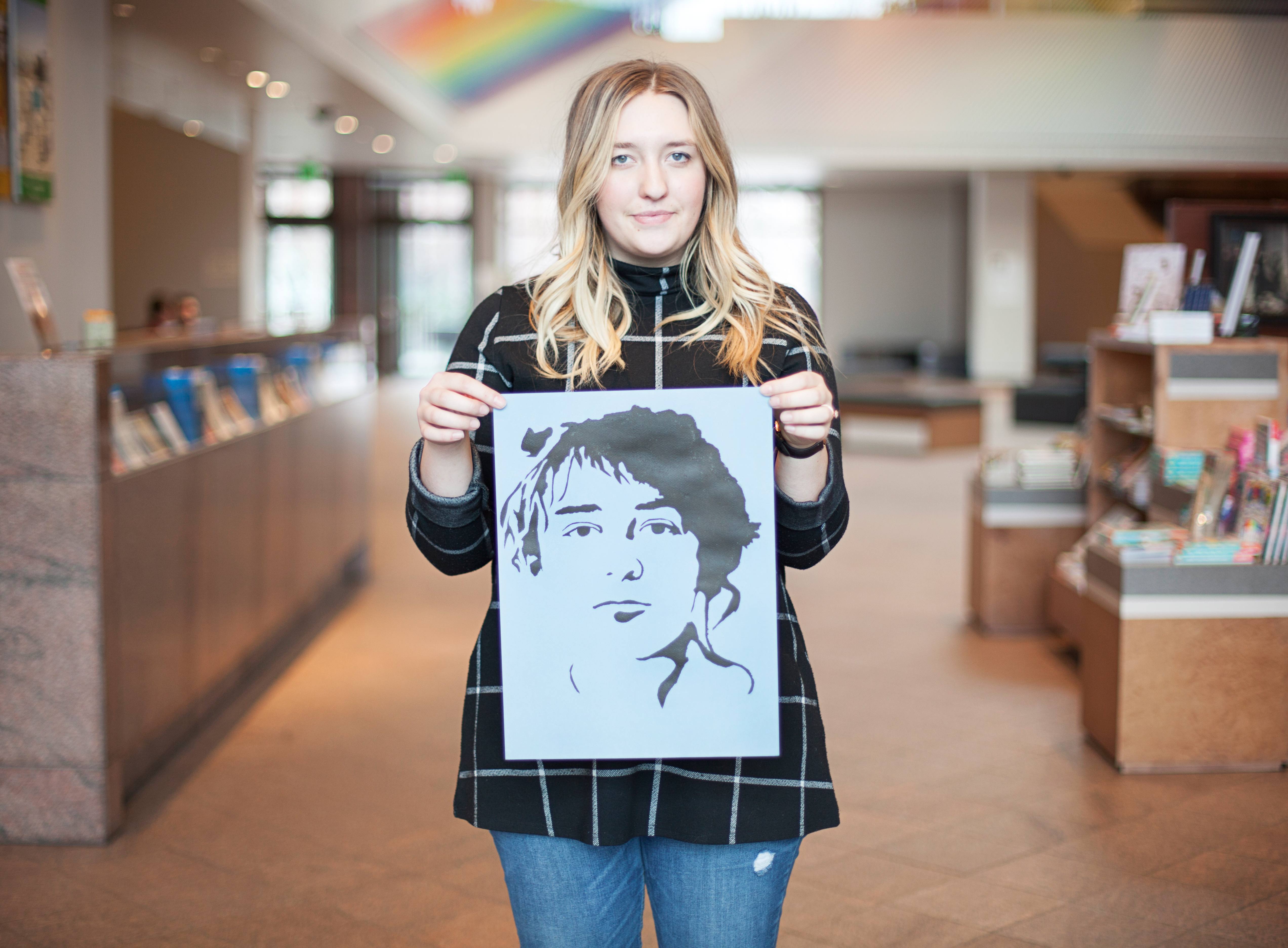 Chiara Elwood Sorenson holds her stencil of Camille Claudel