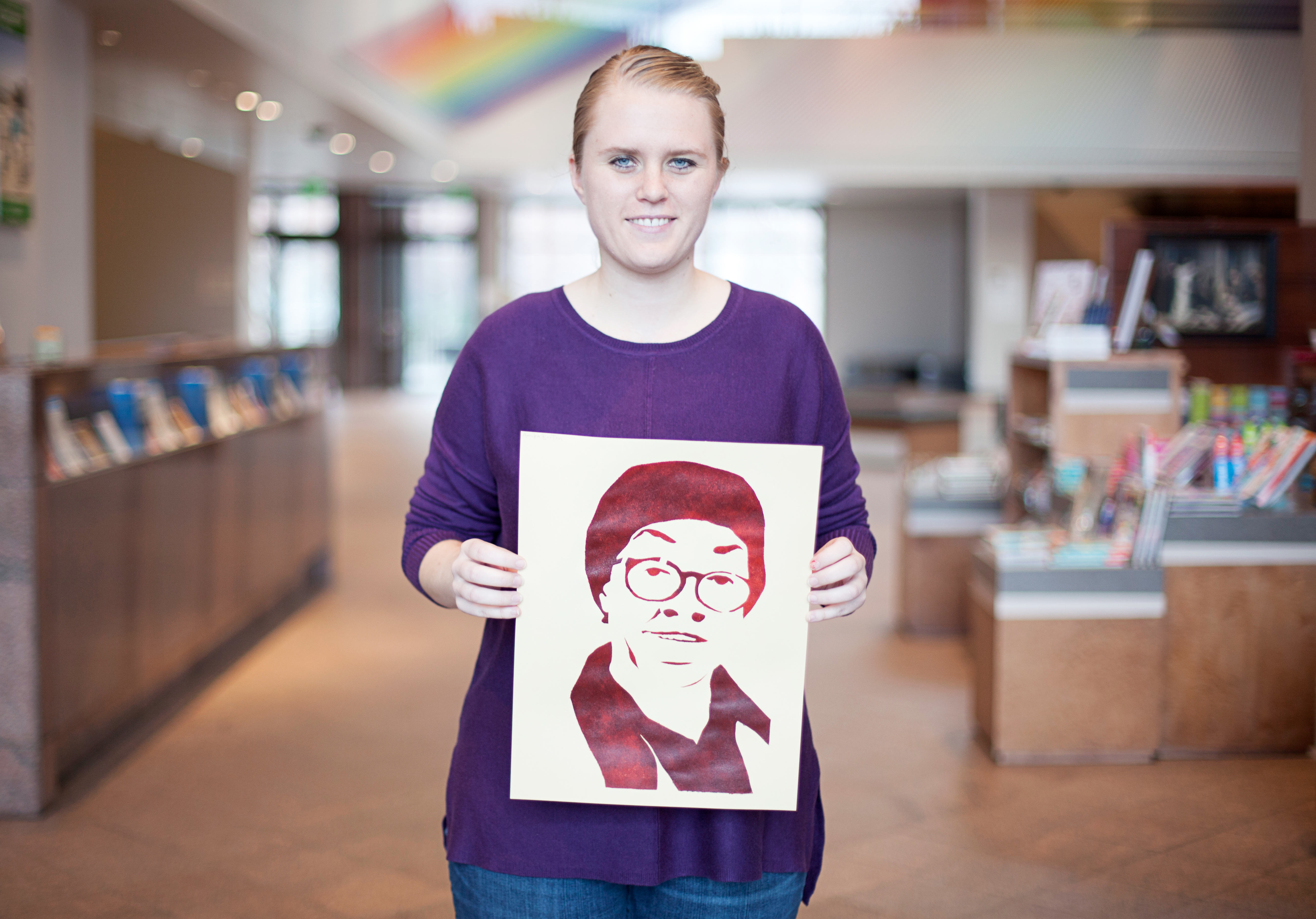 Annika Burton holding her stencil of Gwendolyn Brooks