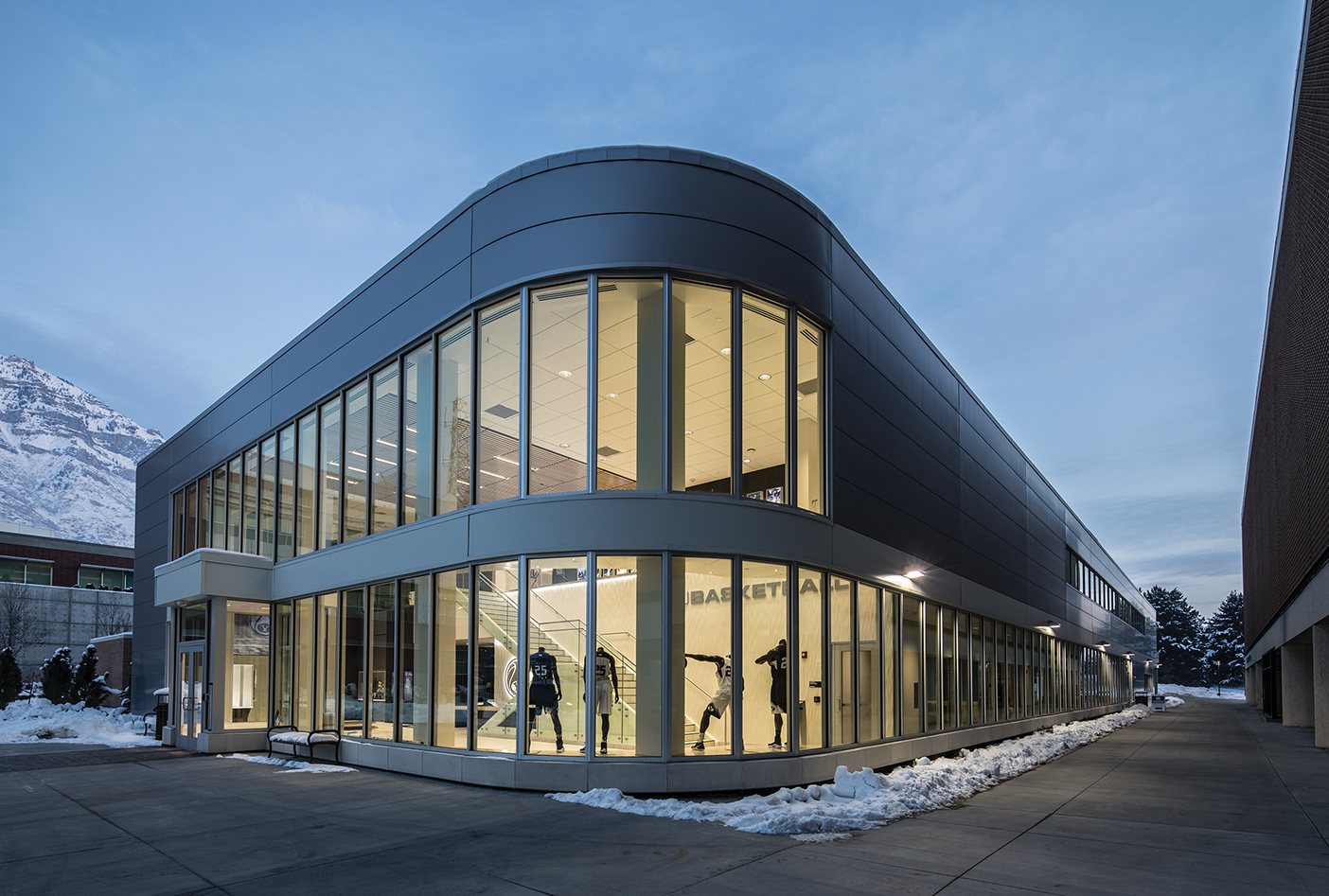 A nighttime shot of the exterior of the BYU Marriott Center Annex.