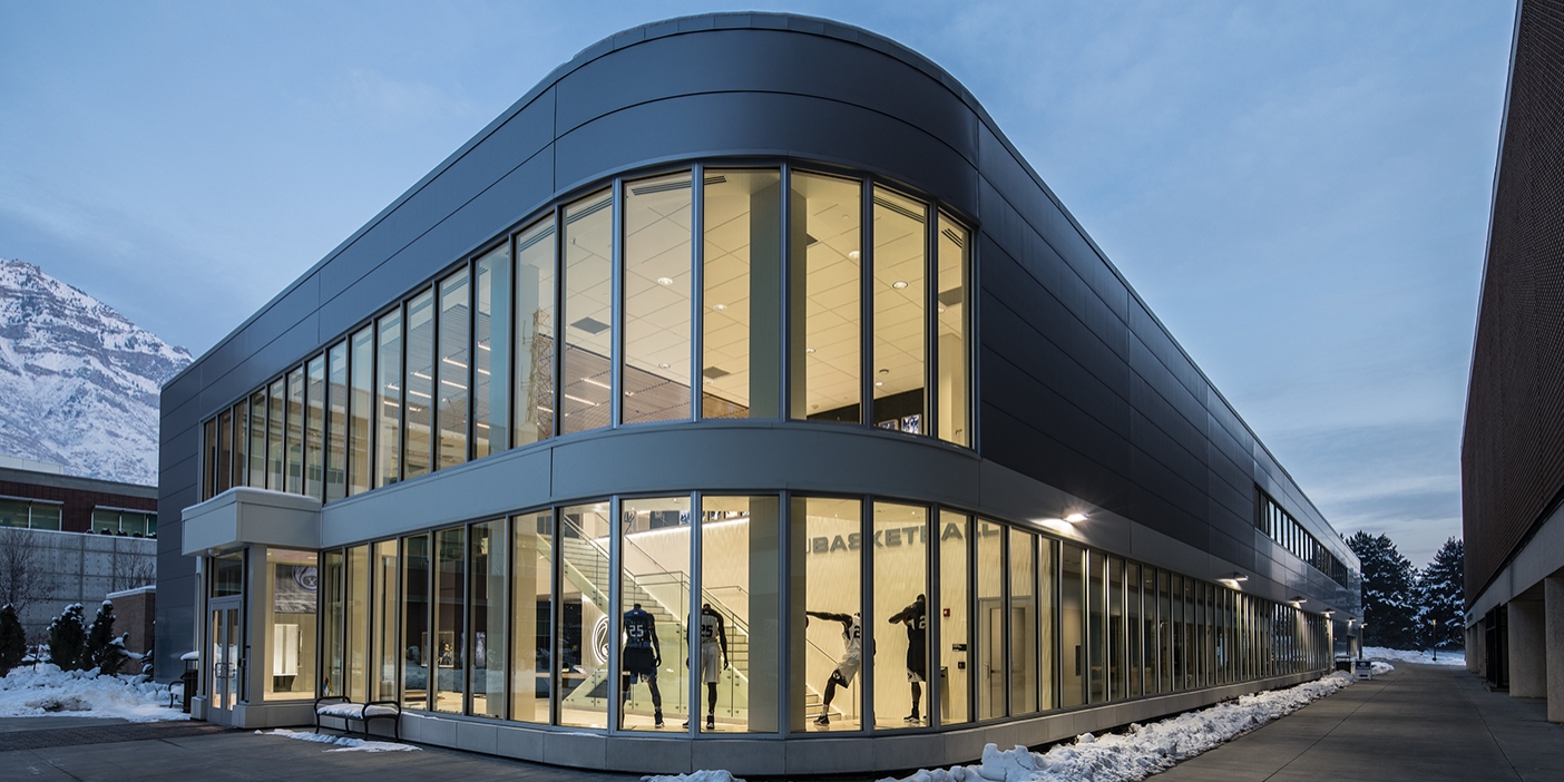 A nighttime shot of the exterior of the BYU Marriott Center Annex.